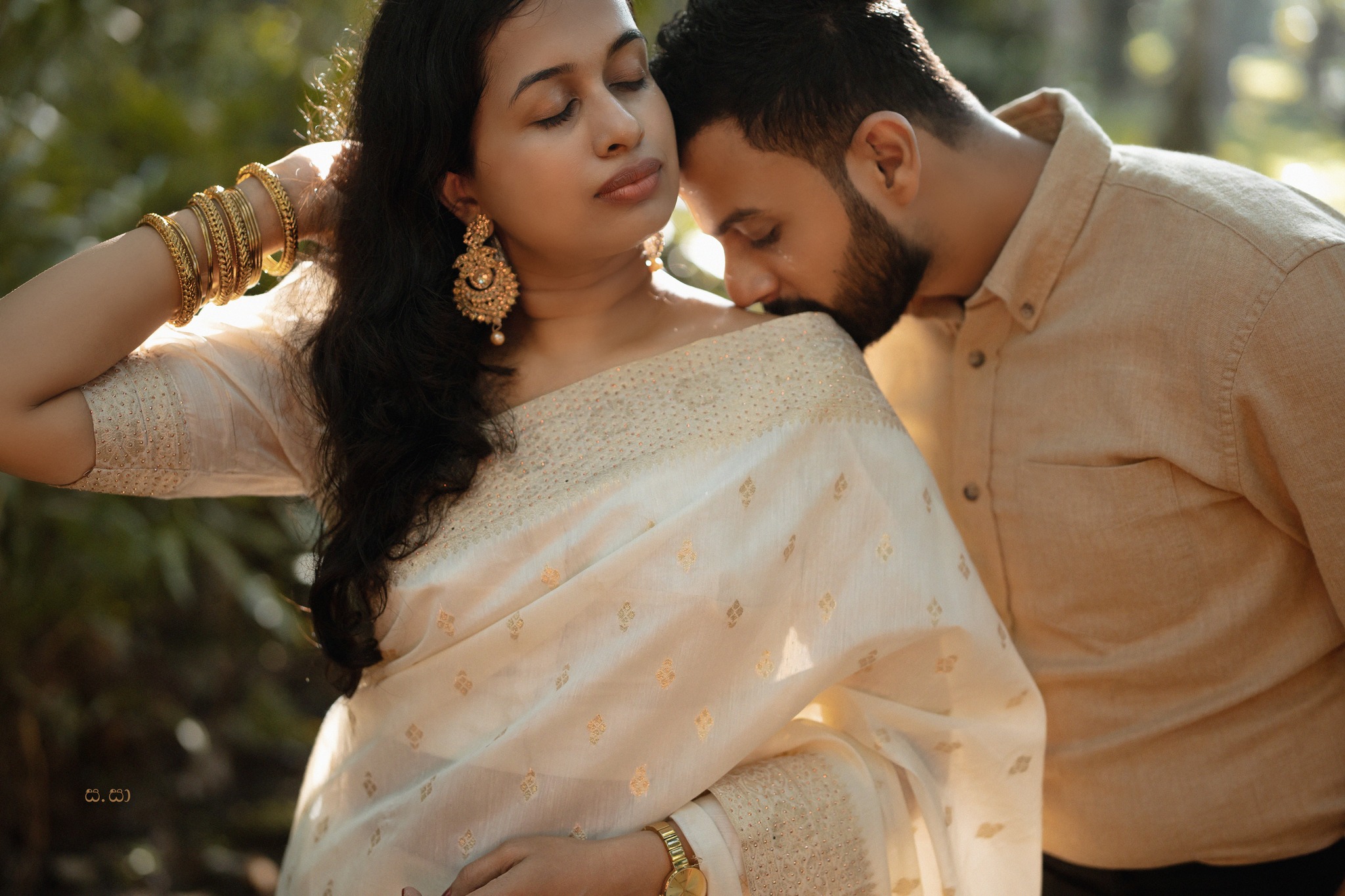 Sanjaya leans toward Hiruni in a softly lit garden portrait.