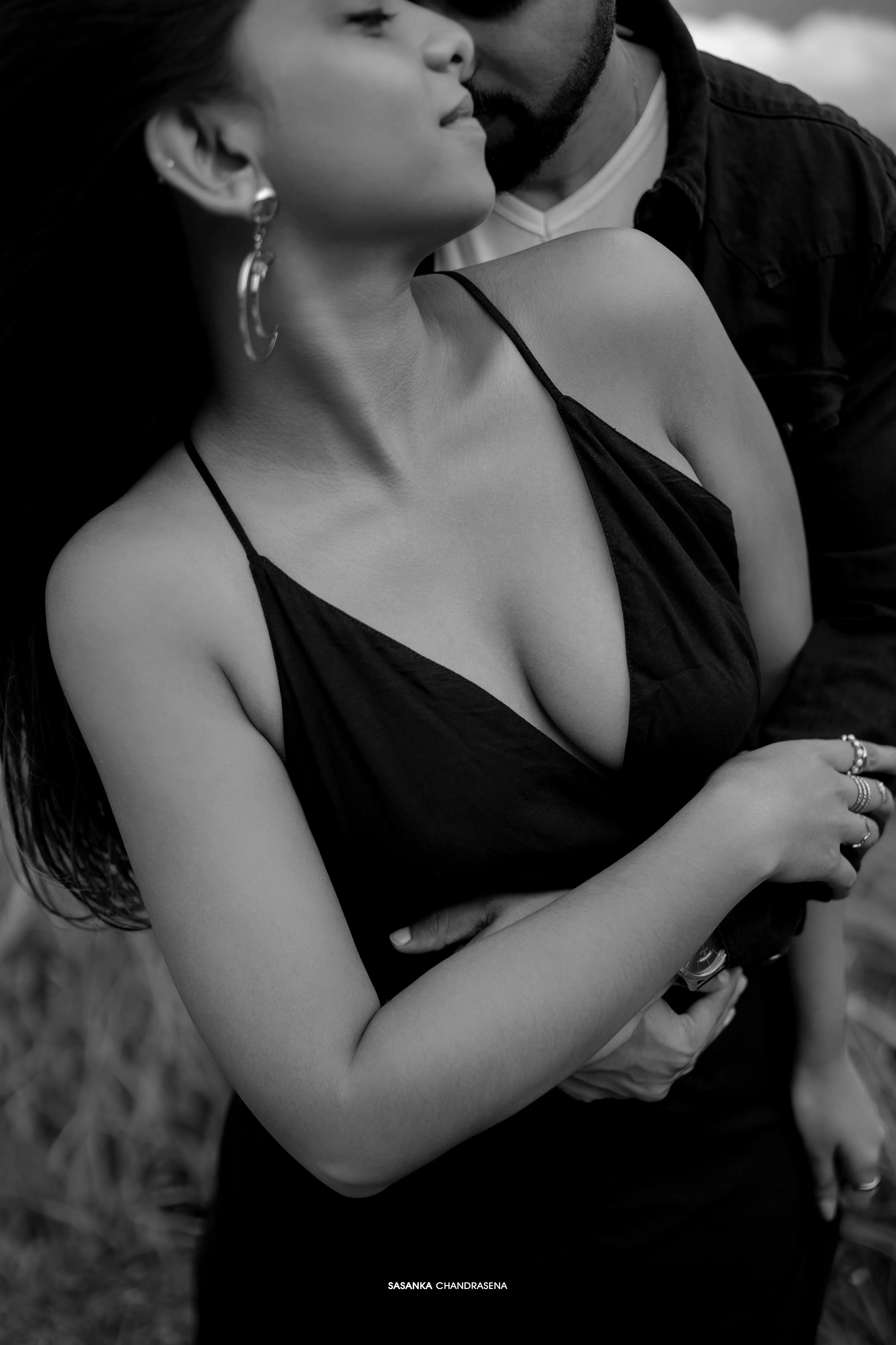 The couple share an intimate black-and-white close-up in the mountain air.