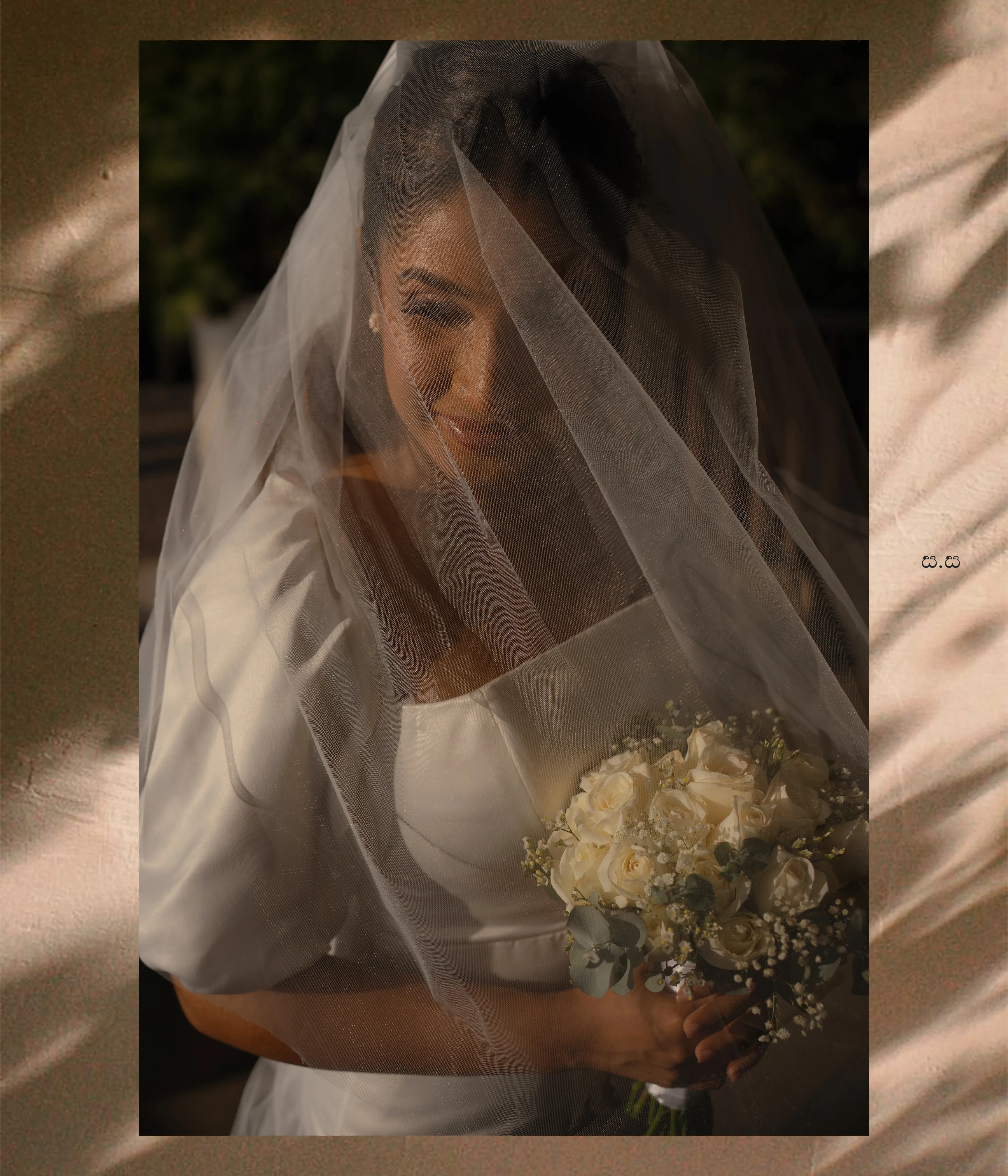 A close portrait catches Malki’s smile through her softly layered veil.