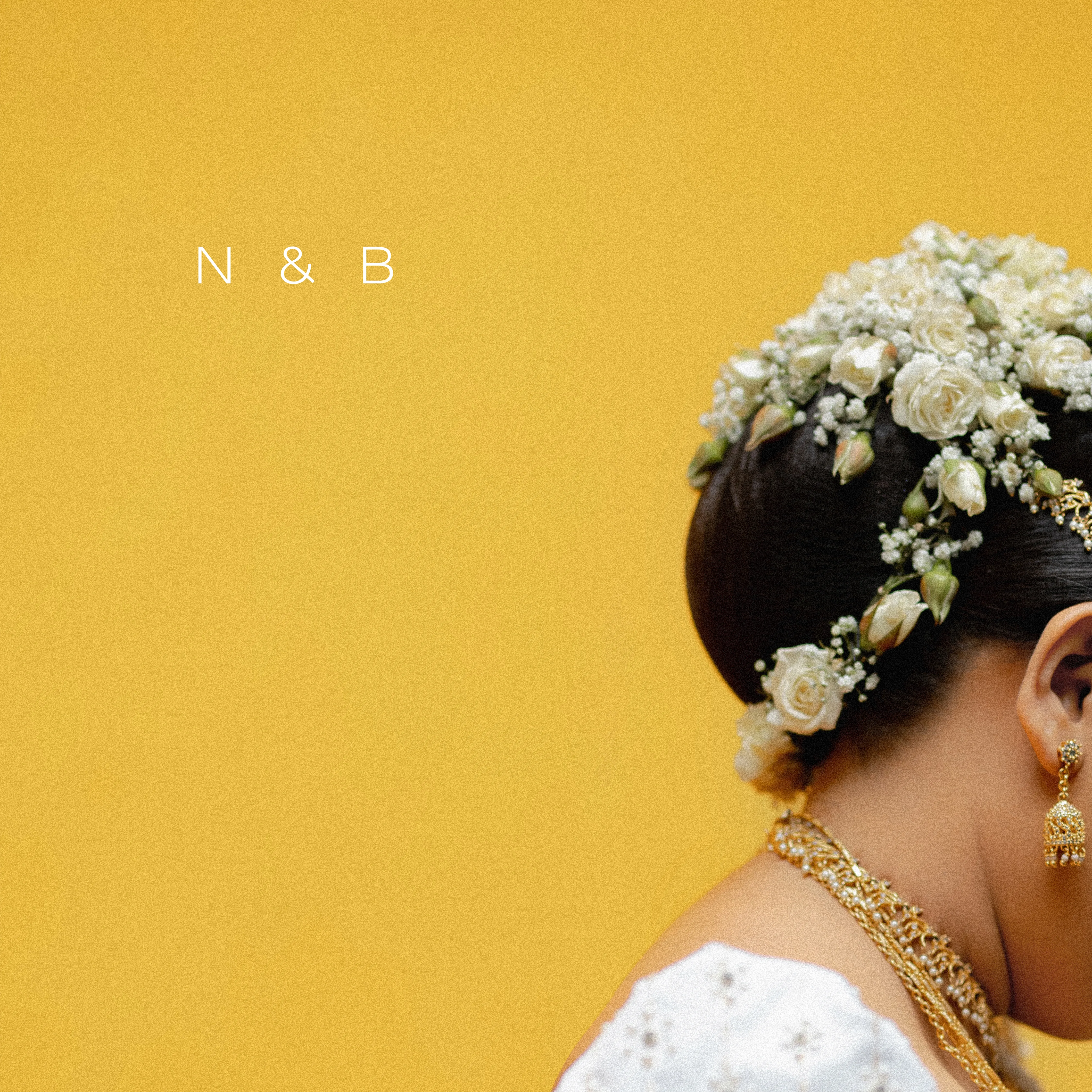 White jasmine and gold jewelry complete Nimasha’s traditional bridal styling.