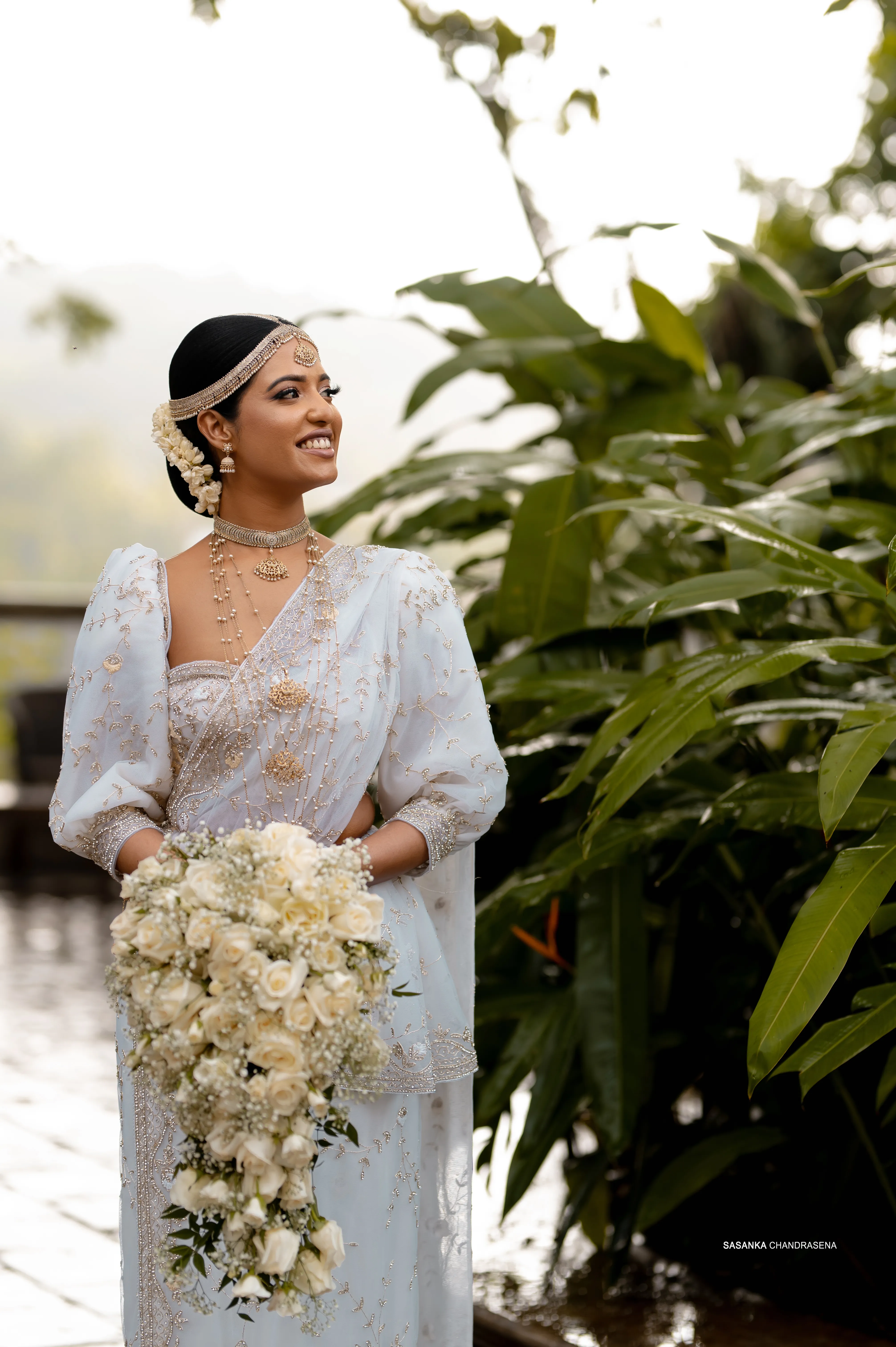 Sachini looks upward in a graceful outdoor portrait.